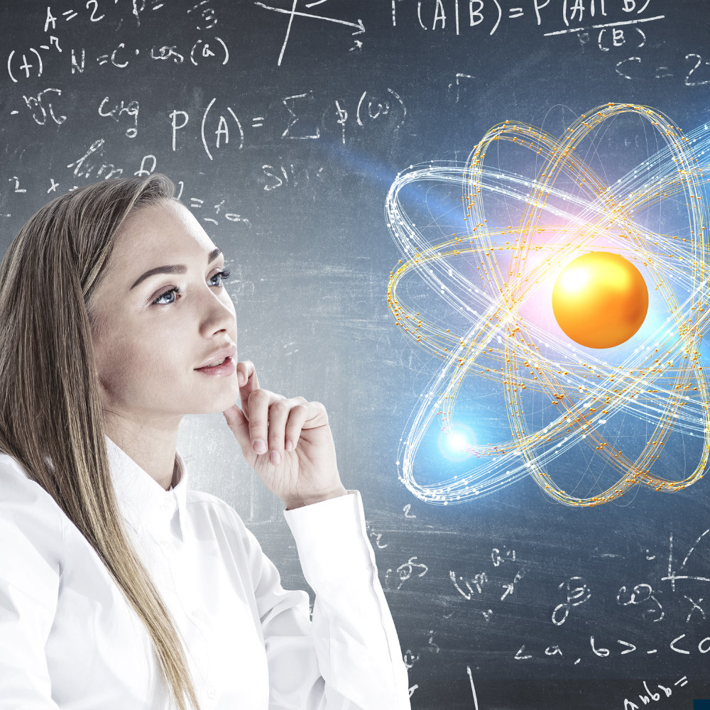 Frau, die auf die Darstellung eines Atoms schaut